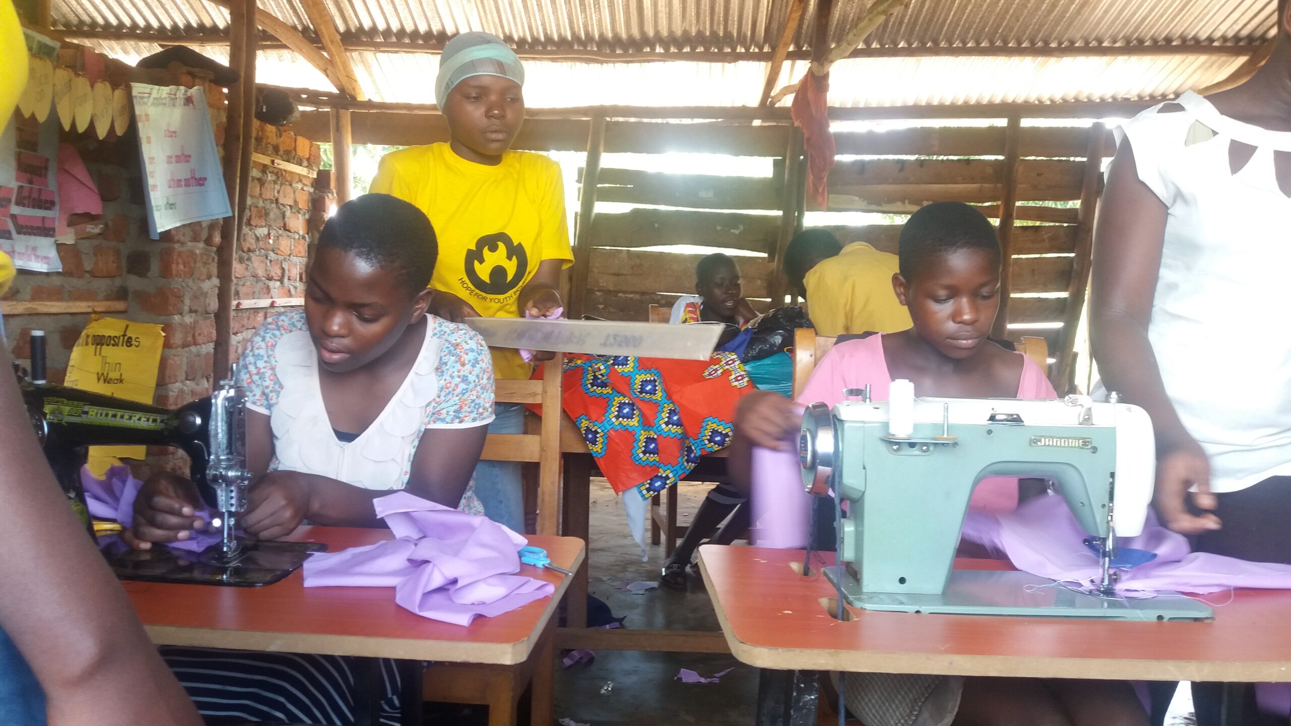 Children learning to tailor their uniforms